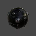 Black Spherical Object With Metallic Components And Shiny Surface Features