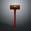 Wooden Gavel With Red Head Handle And Gold Decorative Band On Gray Background