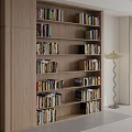 Modern Wooden Bookcase With Multiple Shelves Filled With Books And Floor Lamp