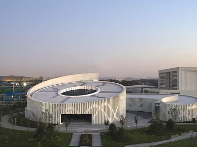 Contemporary Museum Building Featuring Circular Design And White Geometric Facade In Green Surroundings 3d model