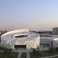 Contemporary Museum Building Featuring Circular Design And White Geometric Facade In Green Surroundings