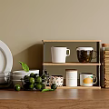 Modern Dinnerware Set With White Plates Glass Bowls Mugs And Green Fruits On Wooden Shelf