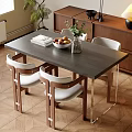 Modern Dining Table Set With White Cushioned Chairs Fruit Bowl Book And Vase