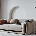 Beige Two Seater Sofa With Orange Light Blue Cream Pillows Arched Wall And Floor Lamp
