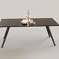 Minimalist Modern Black Dining Table with Sleek Legs and Decorative Silver Centerpieces