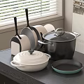Assorted Kitchen Cookware With Covered Pots And Frying Pans On Black Countertop