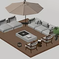 Outdoor Sofa on Wooden Deck with Umbrella Fire Pit Table Chairs Potted Plant and Lanterns