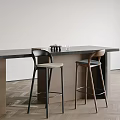 Modern Minimalist Bar Stools With Light Seats At Wooden Bar Counter In Interior Space