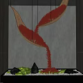 Indoor Landscape Featuring Hanging Woven Vessels Red Particles Flowing Down Black Base Green Moss Stones