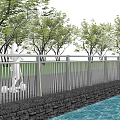 Outdoor Metal Railings With Vertical Bars Along Waterfront Walkway Near Green Trees And Grassland