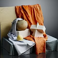 Still Life Composition With Orange Gray Fabrics Clay Pot Geometric Shape And Wooden Board