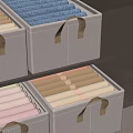 Gray Fabric Organizer Boxes With Gold Handles For Colorful Towel Storage