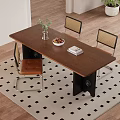Wooden Dining Table With Black Legs And Rattan Back Chairs Indoor Green Plant