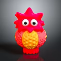 Colorful Red And Yellow Toy Figure With Big Eyes And Textured Surface