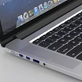 Sleek Apple Laptop Open Screen Showing Galaxy Display With Silver Body And Desktop Icons