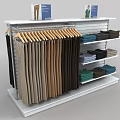 Organized Colored Pants and Folded Clothes on White Retail Display Rack