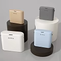 Colorful Mipow Square Living Essentials Displayed On Different Colored Cylindrical Bases