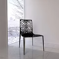 Modern Leisure Chairs with Metal Frame and Hollow Design in Interior with Snowy Window View