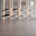 Multiple Modern Washbasins with Circular Mirrors Recessed Lighting White Walls and Gray Flooring