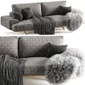 Cozy Grey Velvet Two-Seater Sofa With Black Pillows Soft Fur Throw And Knitted Blanket