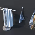 White Towel On Standing Rack And Striped Towels Hanging On Wall Hooks