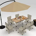 Cozy Outdoor Dining Setup With Beige Umbrella Wooden Table Chairs Food Plates And Small Crate
