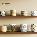 Colorful Decorative Cups With Various Patterns On Wooden Display Shelves