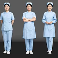 Three Nurses in Blue Medical Uniforms with Nurse Caps Standing in Different Poses