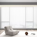 White Blinds Covering Large Window In Modern Room Interior With Gray Chair And Wooden Floor