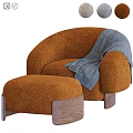 Plush Orange Lounge Chair With Matching Ottoman Blue Throw Blanket And Wooden Legs