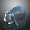 Gray Rabbit Figurine in Lying Position with Droopy Ears and Yellow Green Decoration