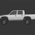 Toyota Silver Four Door Pickup Truck With Off Road Tires And Cab Bed