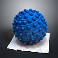 Blue Textured Fitness Massage Ball With Raised Dots On White Paper