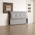 Modern Bedroom Interior With Gray Upholstered Bed Pillows Nightstand Artwork Wooden Floor And Light Rug