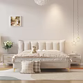 Cozy Double Bed With Upholstered Headboard Golden Legs Bedside Tables White Flowers And Wall Art