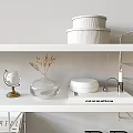 Decorative Ornaments Set on Modern White Shelves with Glass Globe Vase Books and Table Lamp