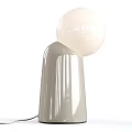 Elegant Contemporary Table Lamp Featuring Spherical Glass Shade And Sleek Transparent Base Design