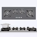 Modern Kitchen Gas Stove With Four Burners And Black Glass Top Design