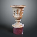 Intricately Carved Vase Shaped Sculpture Featuring Relief Figures On Red Base