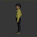Young Boy In Yellow Shirt Dark Pants And Green Shoes Standing Against Gray Background