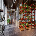 Modern Restaurant Interior With Brick Partition Wooden Table Metal Chairs And Green Plants