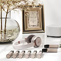 Perfume And Cosmetic Products With Golden Caps White Lids And Glass Containers On Display Shelf