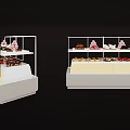 White Display Shelves for Bakery Desserts with Multiple Tiers and Assorted Pastries on Counter