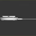 Modern Slim Laptop Charging On Wireless Charger Pad With USB Power Cable