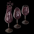 Purple Drink Splashing In Three Wine Glasses Against Black Background