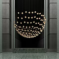 Contemporary Golden Chandelier with Square Shaped Lights in Dark Walled Space with Stairs
