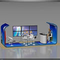 Modern Exhibition Booth With Blue White Design Multiple Screens Tables Chairs And Service Desk Person