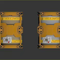 Two Orange Industrial Machinery Units With Metal Frames Black Bolts And Yellow Straps