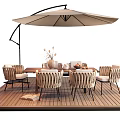 Outdoor Dining Table Setup With Wicker Chairs Patio Umbrella And Wooden Deck