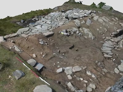Ancient Archeological Site With Scattered Stones Excavated Earth And Grassy Edges 3d model